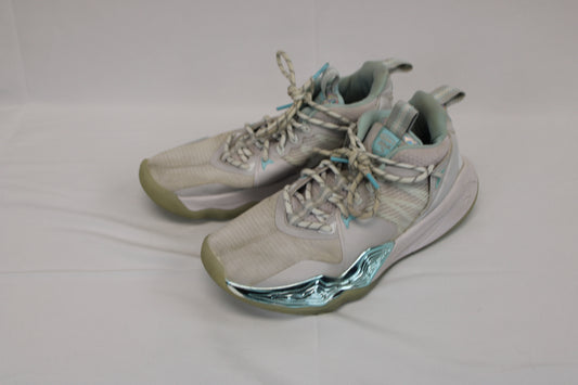 And 1 low top basketball shoe, white/teal metallic, Youth 7