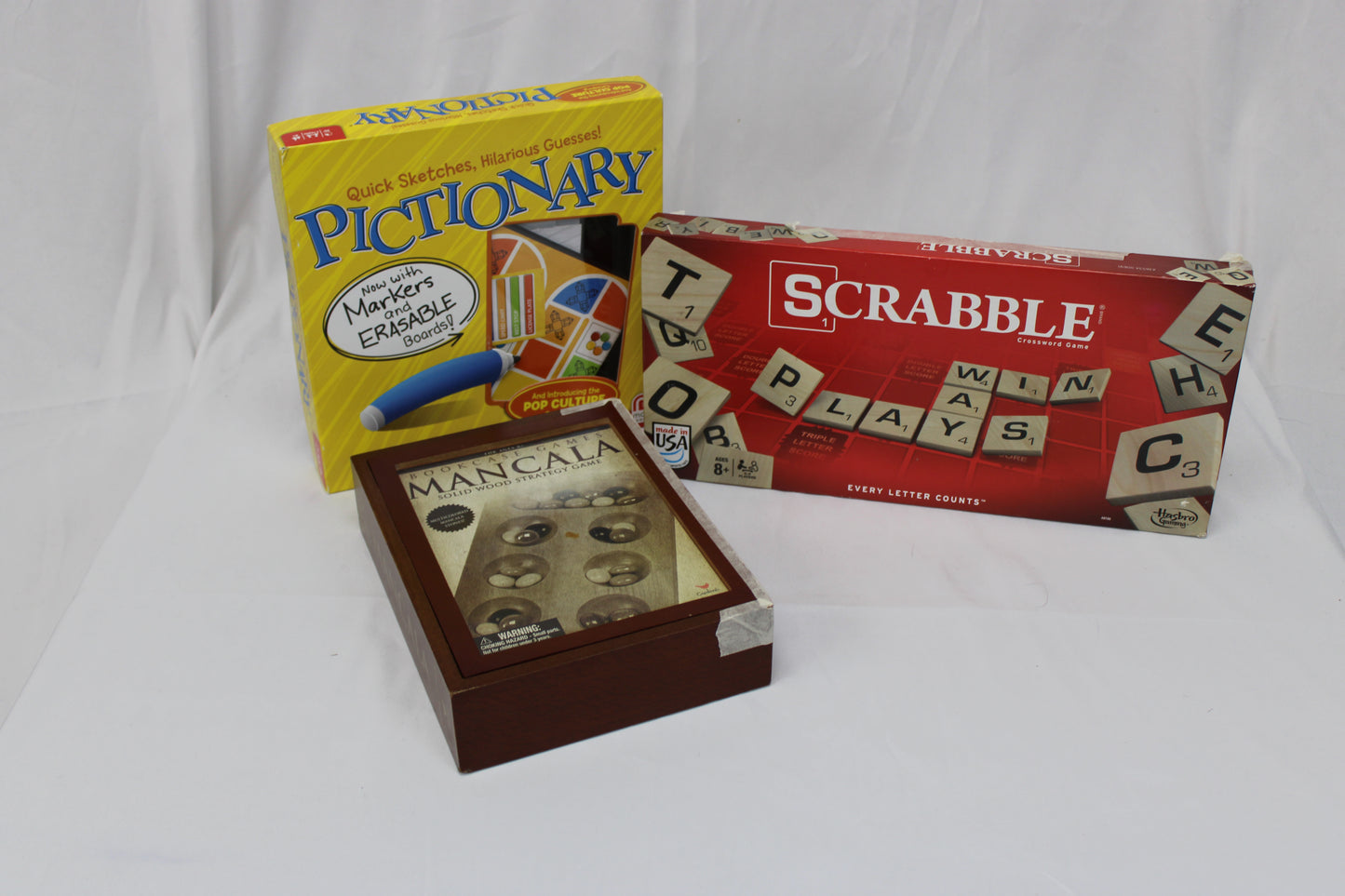Classic board game bundle, featuring Scrabble, Pictionary, and Mancala