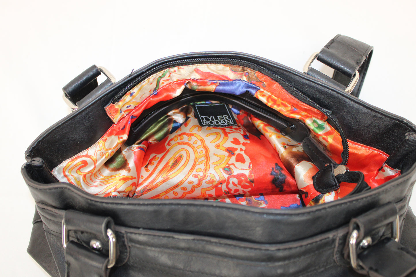 Tyler Rodan black leather purse with paisley silk lining