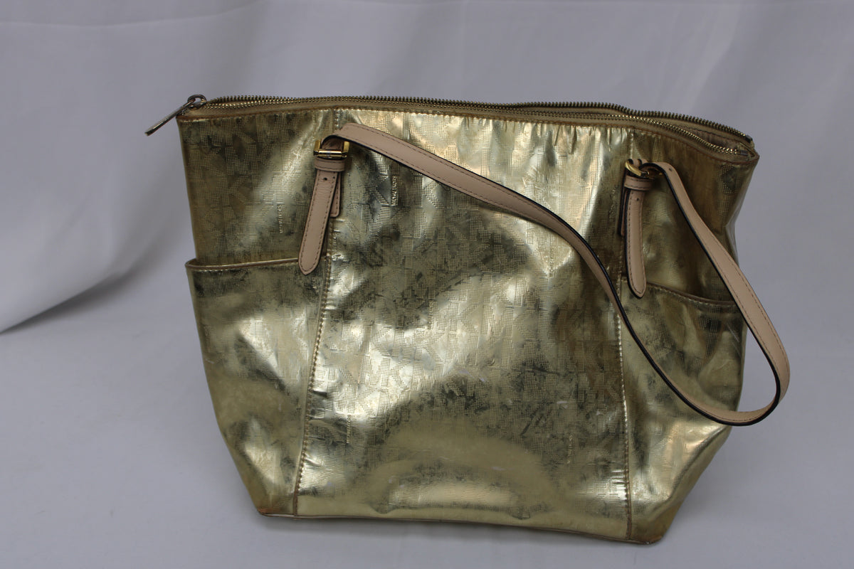 Michael Kors metallic gold tote bag with top zip and exterior pockets, heavy wear
