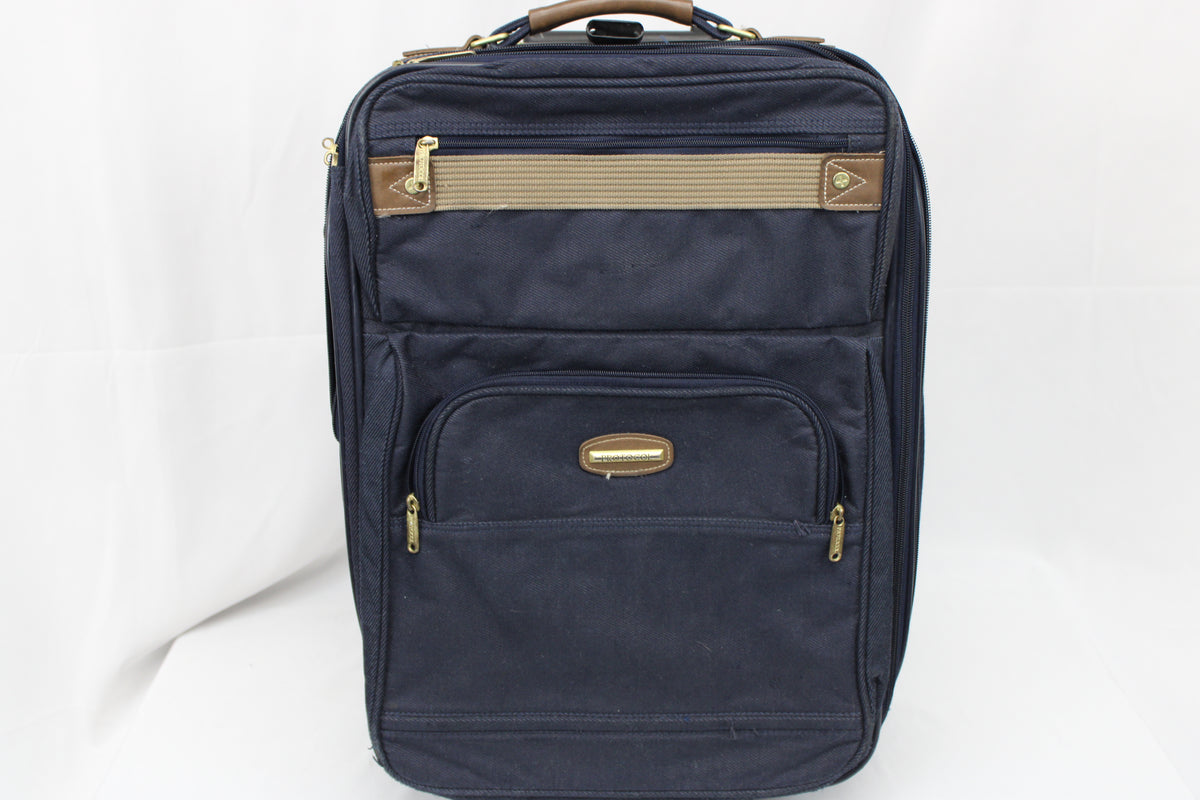 Protocol navy blue carry on sized suitcase with three external pockets