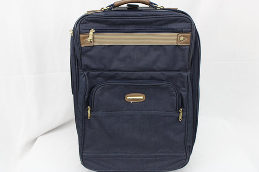 Protocol navy blue carry on sized suitcase with three external pockets
