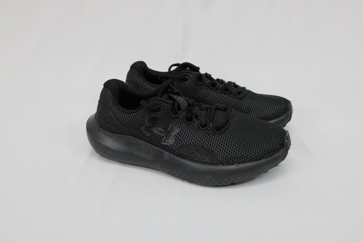 Under Armour Charged Surge 4 running shoe, black/black, Youth 7